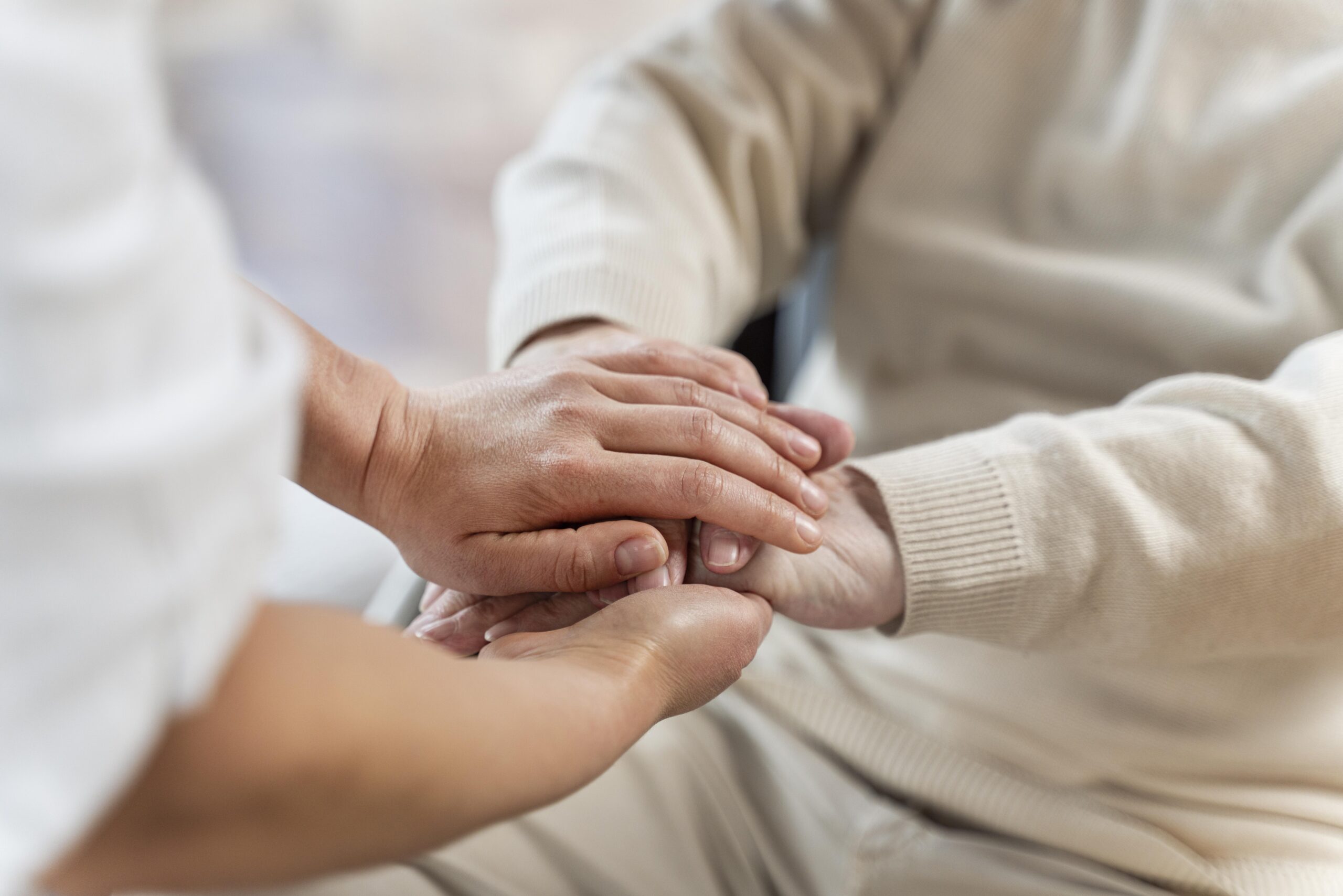 doctor-holding-hands-with-senior-patient